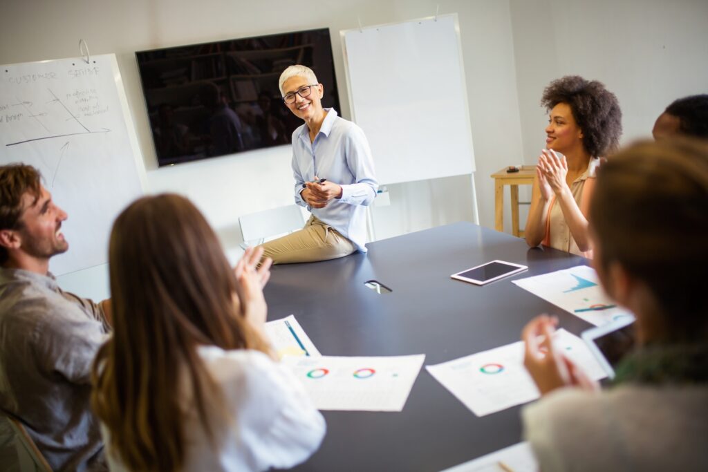Group of happy business people discussing and working together during a meeting in office. Finance architect designer work concept